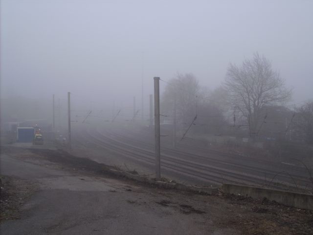 Railway workers shrouded in mist. you can hear 'em, but you can't see 'em.