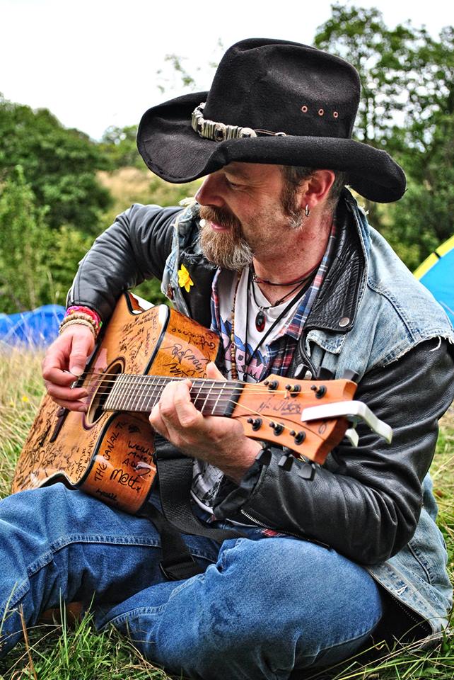 A cowboy and his guitar... collecting signatures on "The Torch" guitar at Farmfest, 23/08/2014. Pic by Gav Wyatt.